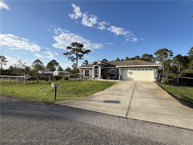 ranch-style home featuring a garage and a front lawn