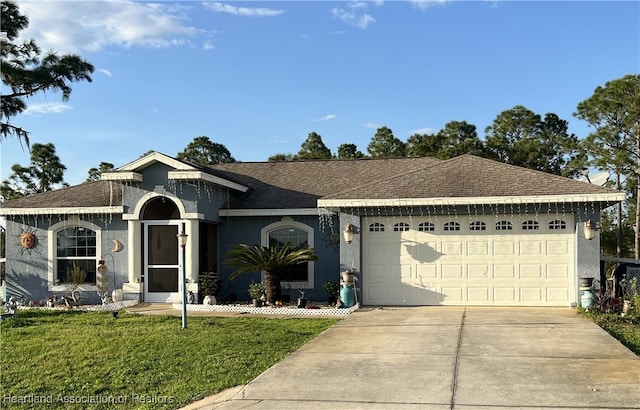 single story home with a garage and a front yard