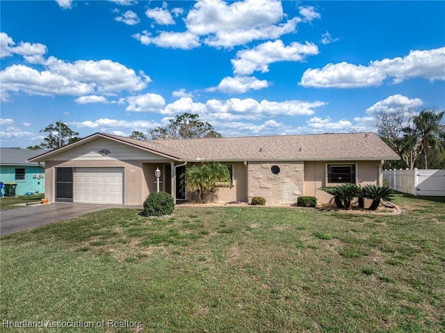 single story home featuring a garage and a front lawn