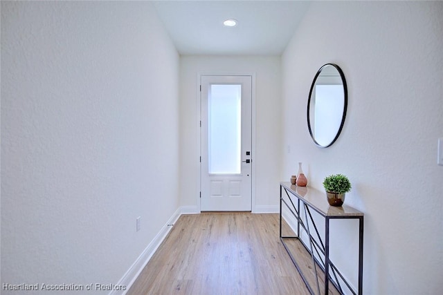 doorway with light hardwood / wood-style floors