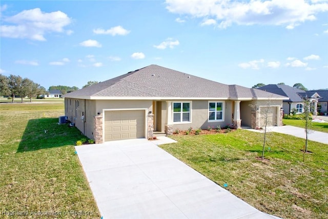 ranch-style home with a garage, a front lawn, and central air condition unit