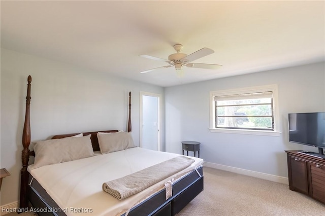 bedroom featuring ceiling fan and light colored carpet