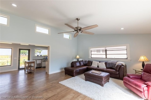 living room with hardwood / wood-style floors and ceiling fan