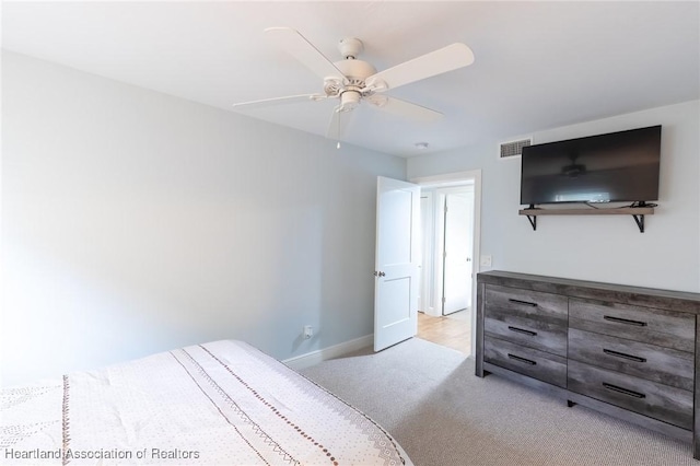 bedroom featuring ceiling fan and light colored carpet