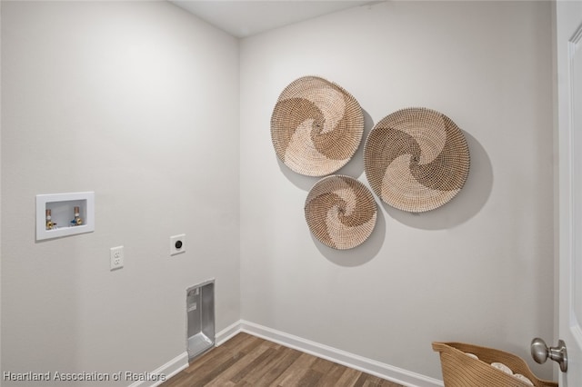 laundry area featuring hookup for an electric dryer, dark hardwood / wood-style floors, and hookup for a washing machine