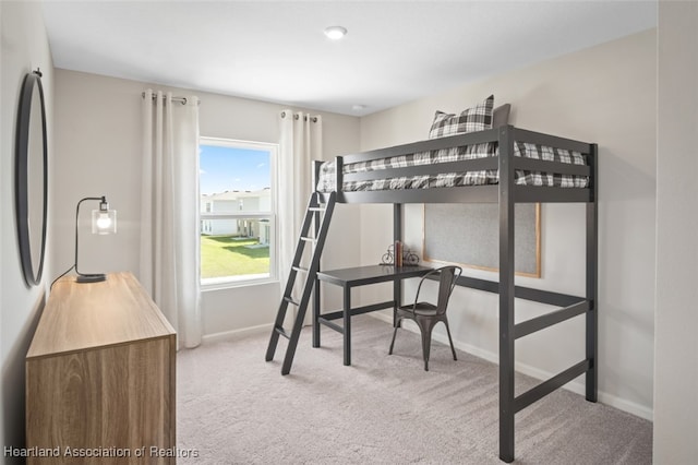 carpeted bedroom featuring refrigerator