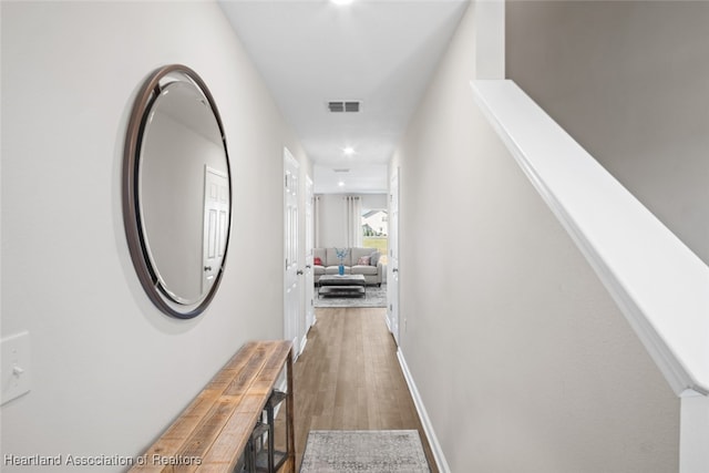 hallway featuring hardwood / wood-style flooring