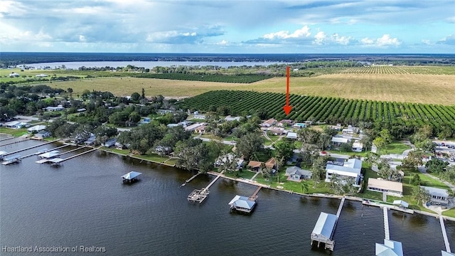 aerial view with a rural view and a water view