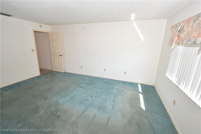 spare room featuring carpet