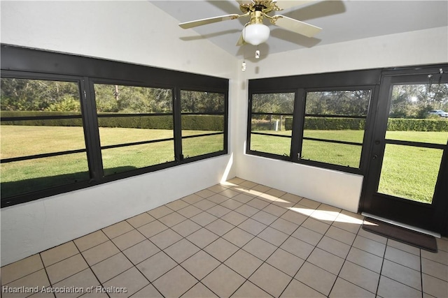 unfurnished sunroom with ceiling fan