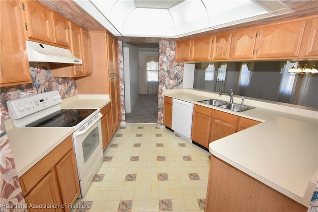 kitchen featuring sink and white appliances