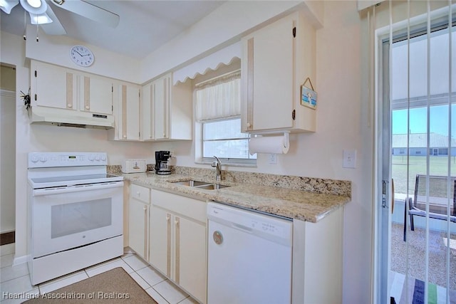 kitchen with white appliances, light tile patterned floors, ceiling fan, a sink, and under cabinet range hood
