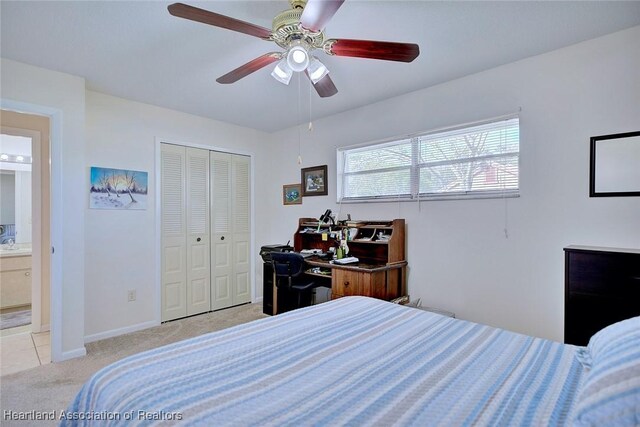 bedroom with a closet, carpet floors, baseboards, and ceiling fan