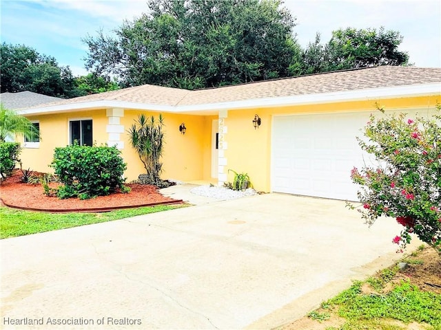 single story home with a garage