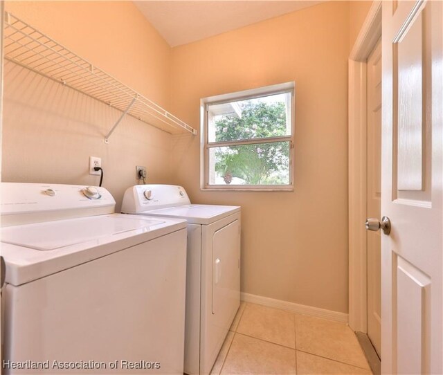 4021 Page Ave, Sebring, FL 33875 - laundry area with washing machine and dryer and light tile patterned floors