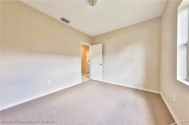 4021 Page Ave, Sebring, FL 33875 - spare room featuring carpet and baseboards