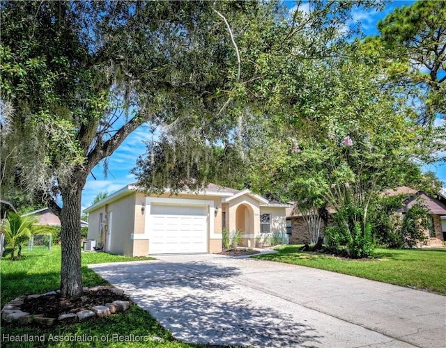 4021 Page Ave, Sebring, FL 33875 - view of front facade with concrete driveway, stucco siding, a front lawn, and an attached garage