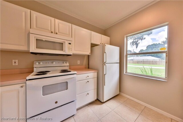 4021 Page Ave, Sebring, FL 33875 - kitchen featuring white appliances, light countertops, crown molding, white cabinetry, and light tile patterned flooring