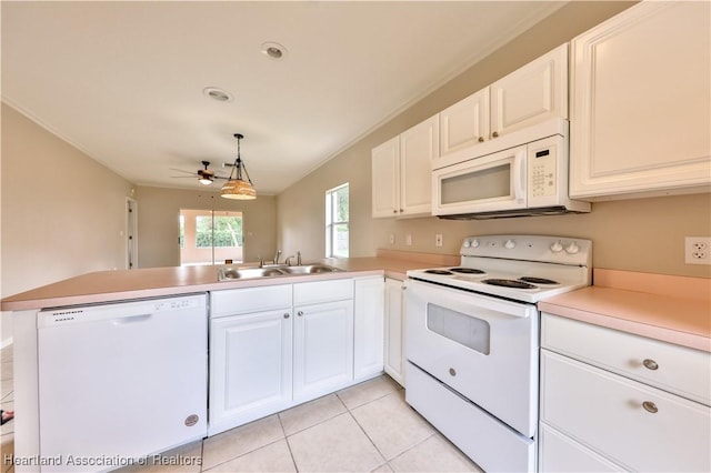 4021 Page Ave, Sebring, FL 33875 - kitchen featuring white appliances, a peninsula, a ceiling fan, light countertops, and light tile patterned floors