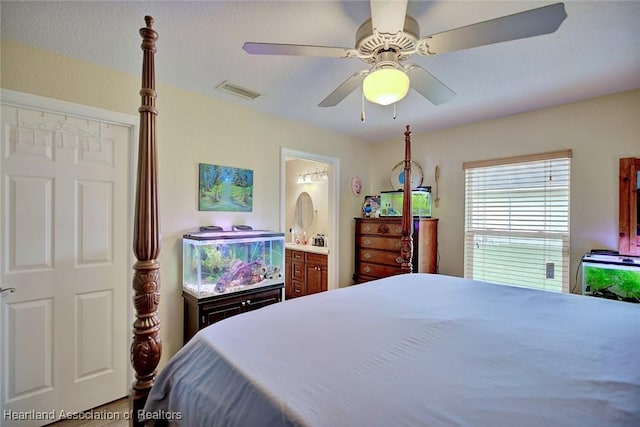 bedroom with ensuite bath and ceiling fan