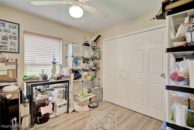 interior space with ceiling fan and light wood-type flooring