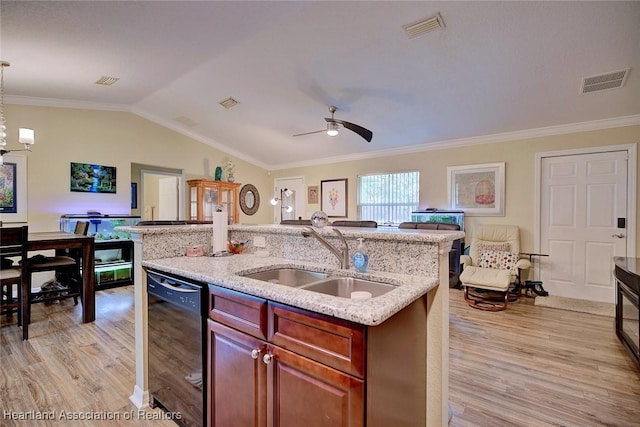 kitchen featuring pendant lighting, sink, black dishwasher, ornamental molding, and vaulted ceiling