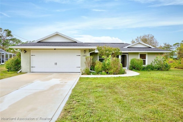 single story home with a garage and a front lawn