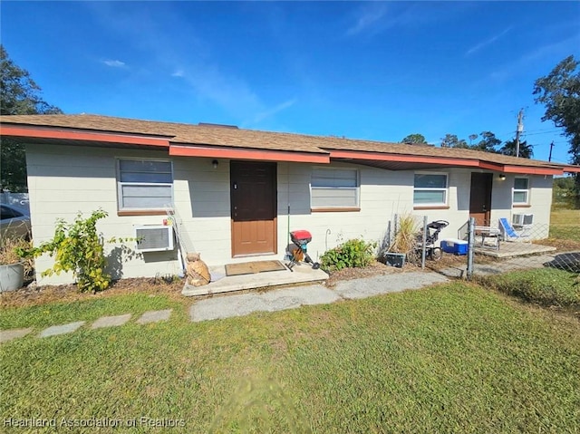 ranch-style home with a front lawn