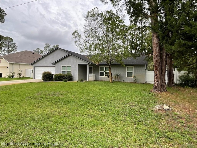 single story home with concrete driveway, a garage, and brick siding