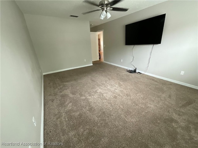 unfurnished living room with carpet floors, ceiling fan, and baseboards
