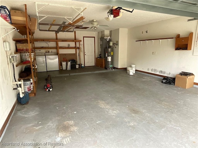 garage featuring washing machine and clothes dryer, fridge, a garage door opener, electric water heater, and a ceiling fan