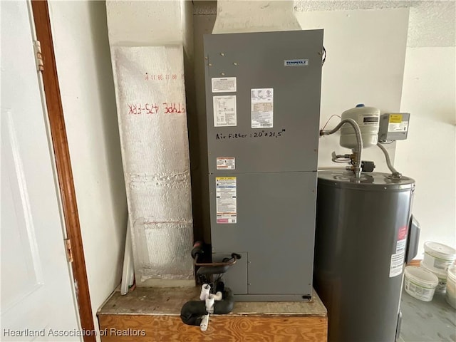utility room featuring electric water heater and heating unit