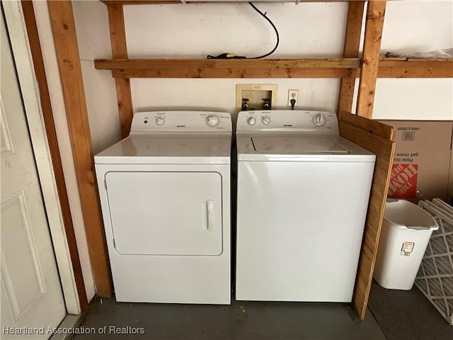 clothes washing area featuring washer and clothes dryer