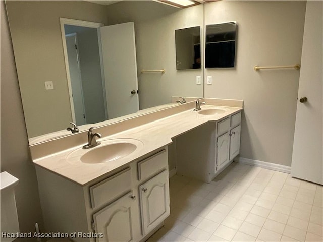 full bathroom with double vanity and tile patterned floors