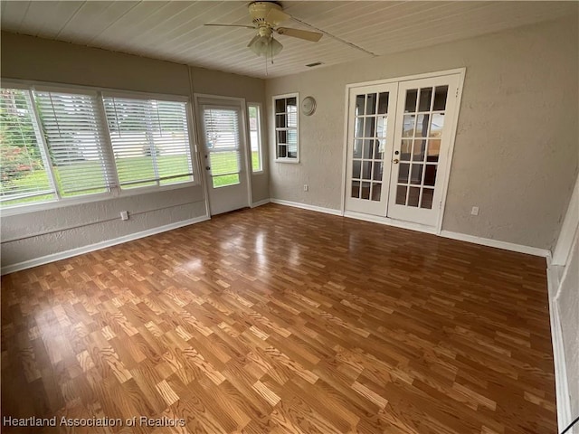 unfurnished sunroom featuring french doors