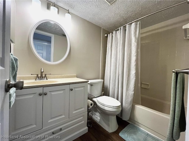 full bathroom featuring a textured ceiling, toilet, wood finished floors, vanity, and shower / bath combination with curtain