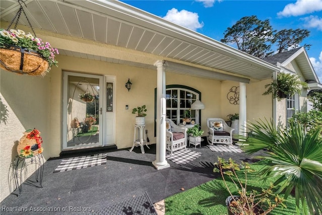 property entrance featuring stucco siding