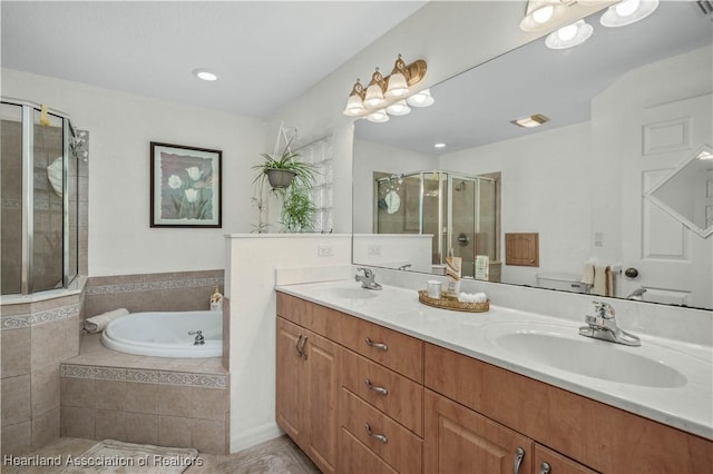 bathroom with a garden tub, double vanity, a sink, and a shower stall