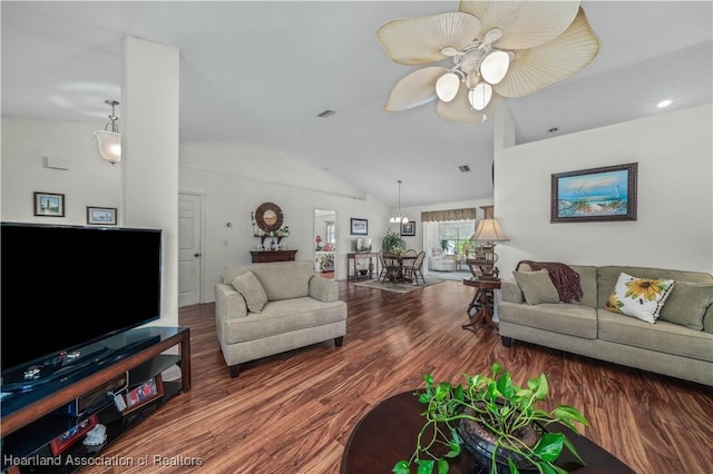 living room featuring ceiling fan, visible vents, vaulted ceiling, and wood finished floors