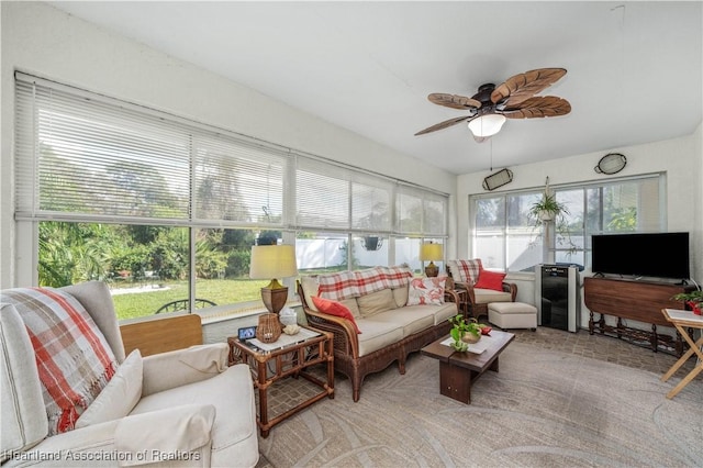 sunroom / solarium with a ceiling fan