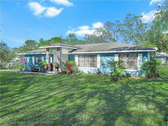 ranch-style house with a front lawn