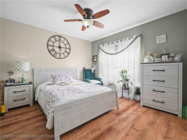 bedroom featuring ceiling fan and hardwood / wood-style flooring