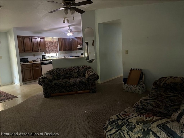16 Notre Dame St, Lake Placid, FL 33852 - living area with light tile patterned floors, baseboards, and a ceiling fan