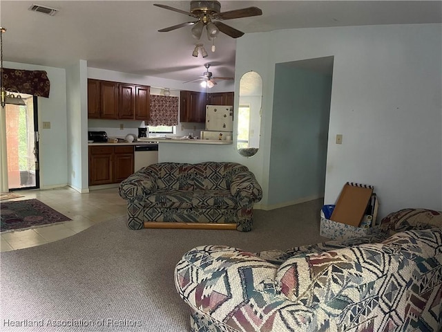 16 Notre Dame St, Lake Placid, FL 33852 - living area featuring ceiling fan, baseboards, light tile patterned floors, lofted ceiling, and visible vents