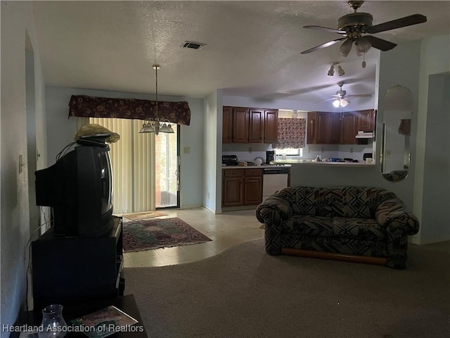 16 Notre Dame St, Lake Placid, FL 33852 - living room with visible vents, light carpet, a textured ceiling, a ceiling fan, and light tile patterned floors