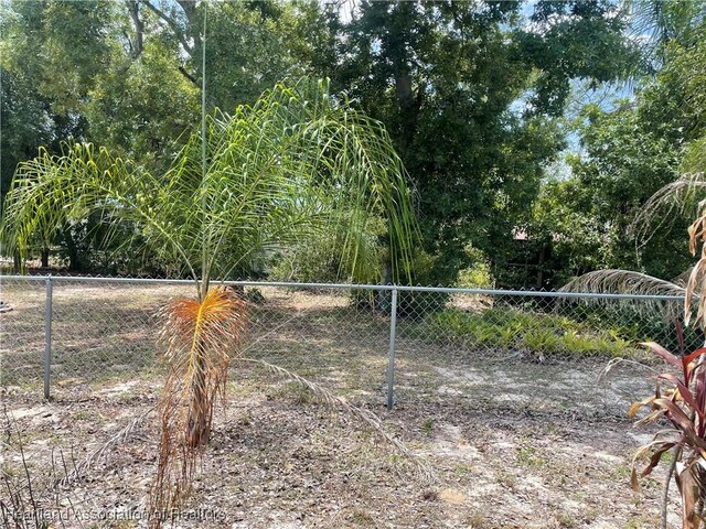 16 Notre Dame St, Lake Placid, FL 33852 - view of gate with fence