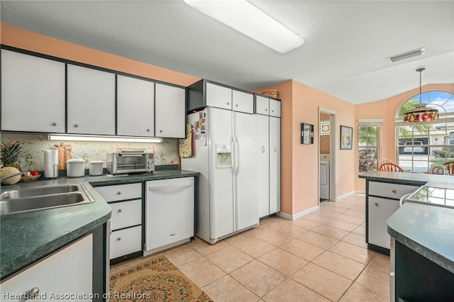 kitchen featuring white appliances, white cabinets, decorative backsplash, decorative light fixtures, and light tile patterned flooring