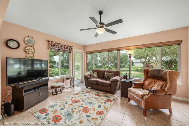 tiled living room with ceiling fan