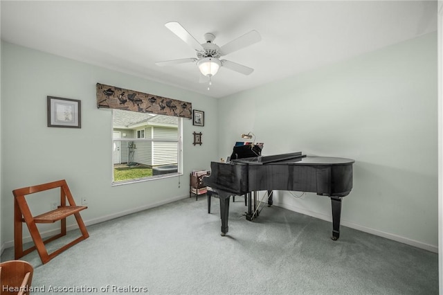 misc room featuring ceiling fan and carpet