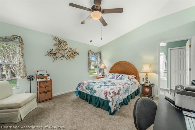 bedroom with carpet flooring, ceiling fan, and vaulted ceiling